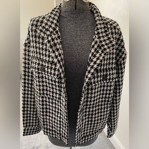 NWOT. Never worn. Beautiful checkered jacket.
